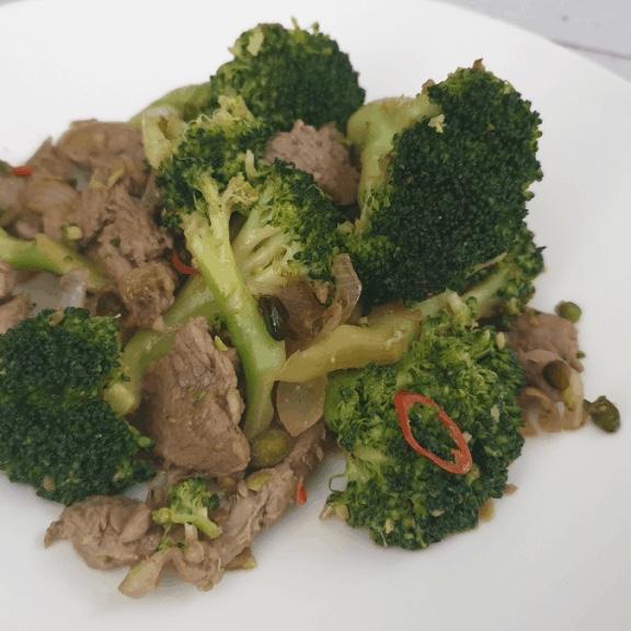 Sauteed Veal with Lemon on a Bed of Broccoli Rabe